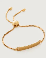 Gold adjustable bar bracelet on white background