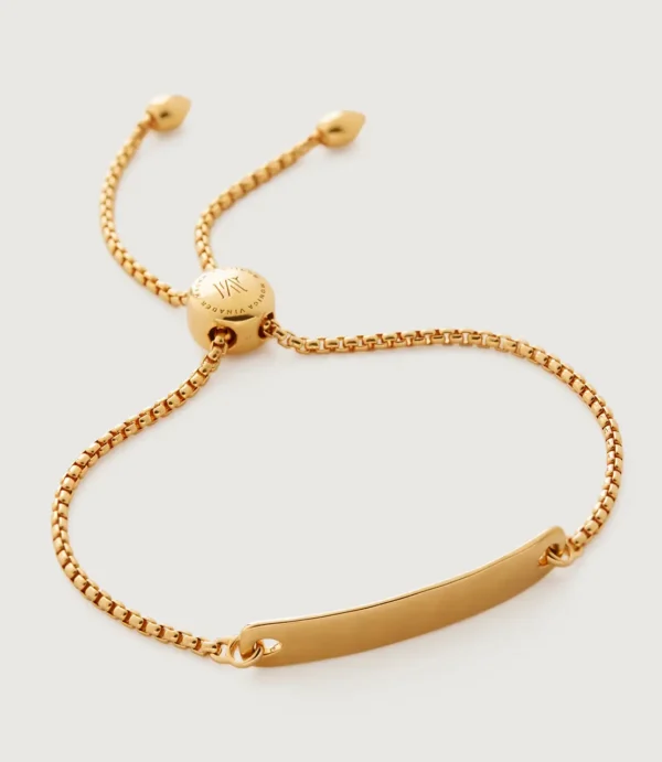 Gold adjustable bar bracelet on white background