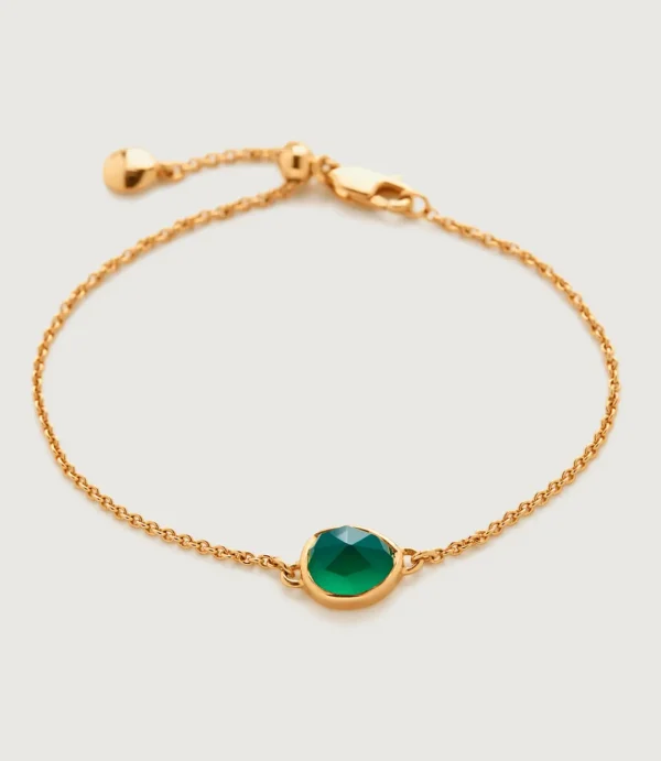 Gold chain bracelet with green gemstone