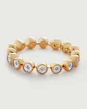 Gold bracelet with round bezel-set diamonds
