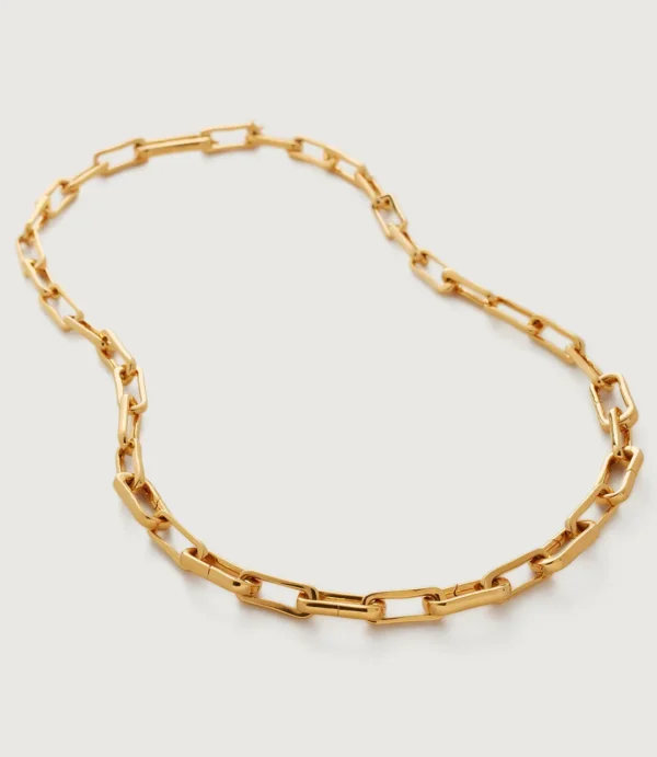 Gold paperclip chain necklace on white background