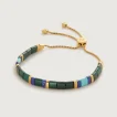 Gold adjustable bracelet with green and blue beads
