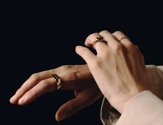 Close-up of hands wearing gold rings