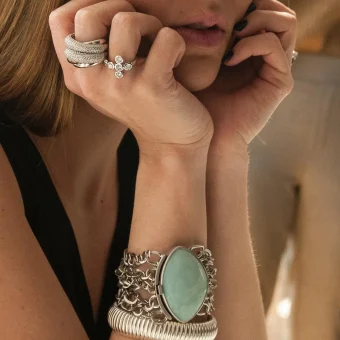 Close-up of hands with rings and bracelets